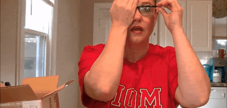 GIF of woman adjusting the Vi-Shift glasses to her eyes
